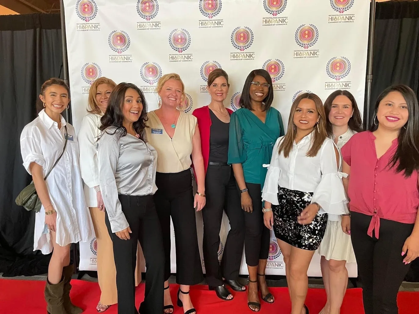 Carole Mendoza with the women of the Metropolitan Savannah Hispanic Chamber of Commerce