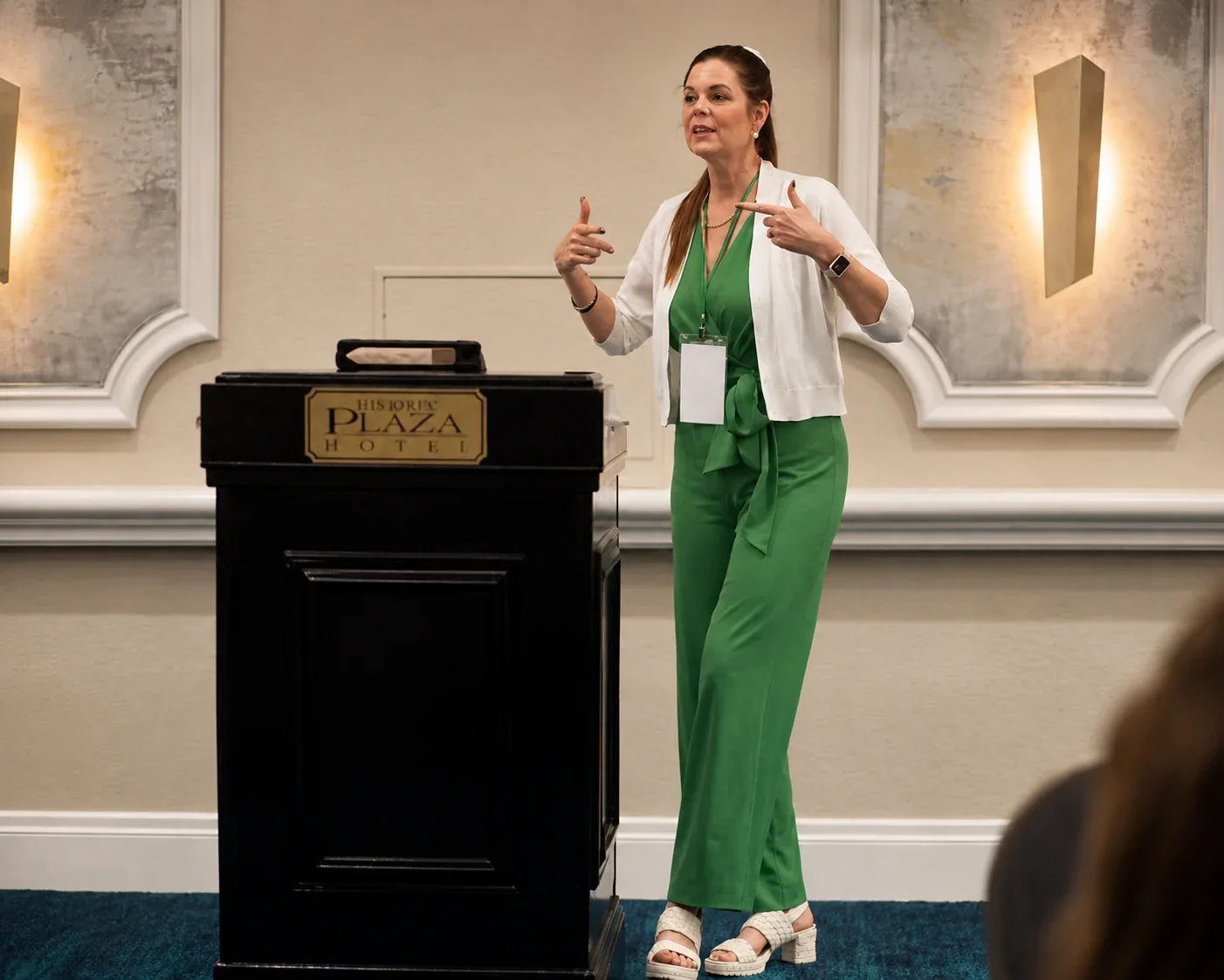 Carole Mendoza speaking at the Historic Plaza Hotel